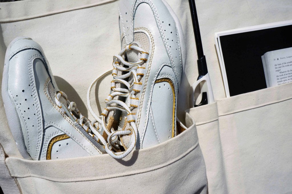  photo of a pair of trainers in an artist's tool roll